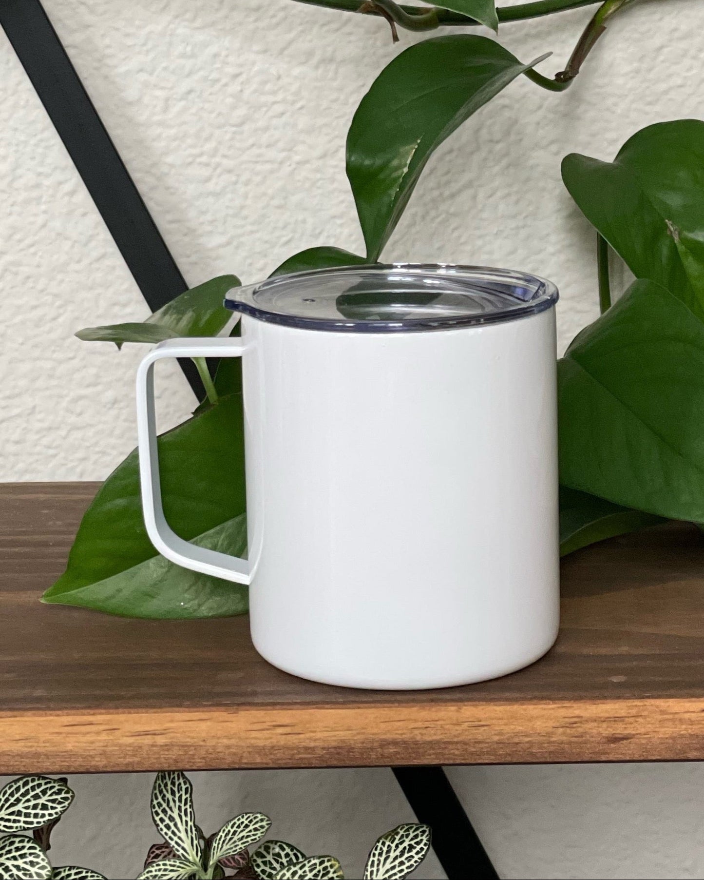 White double walled stainless steel mug with handle and clear push on lid that has a slide close.